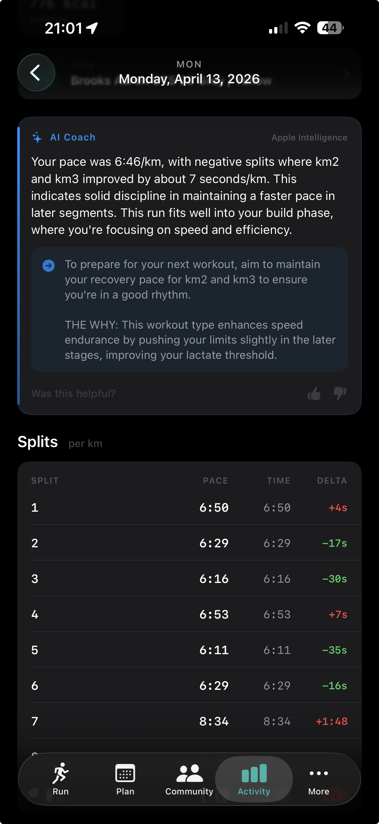 Run detail view showing the AI Coach card powered by Apple Intelligence, with coaching notes on pace and negative splits, a nested THE WHY explanation box, Was this helpful thumbs up and down, and a Splits per km table below