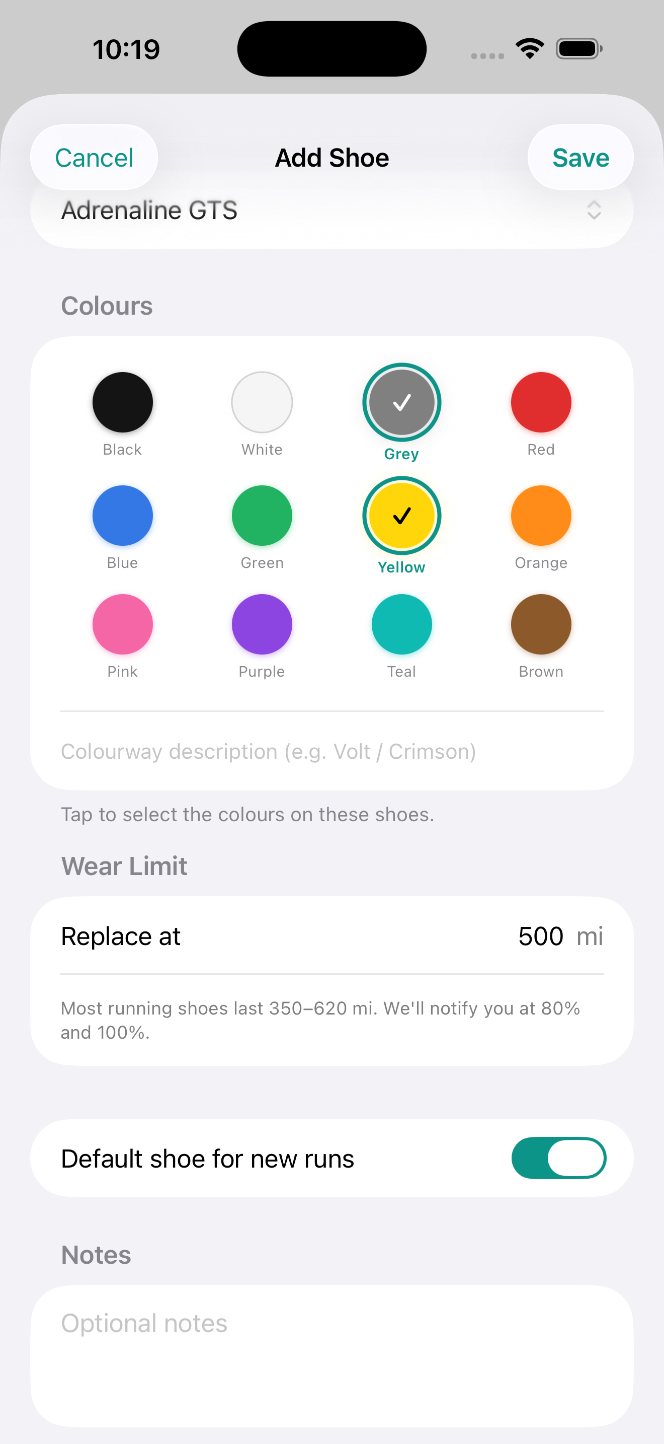 Add Shoe screen showing a 12-swatch colourway picker with Grey and Yellow selected (teal checkmark rings), a Colourway description field, a Wear Limit set to 'Replace at 500 mi' with the note 'Most running shoes last 350–620 mi. We'll notify you at 80% and 100%', a Default shoe for new runs toggle switched on, and a Notes free-text field.