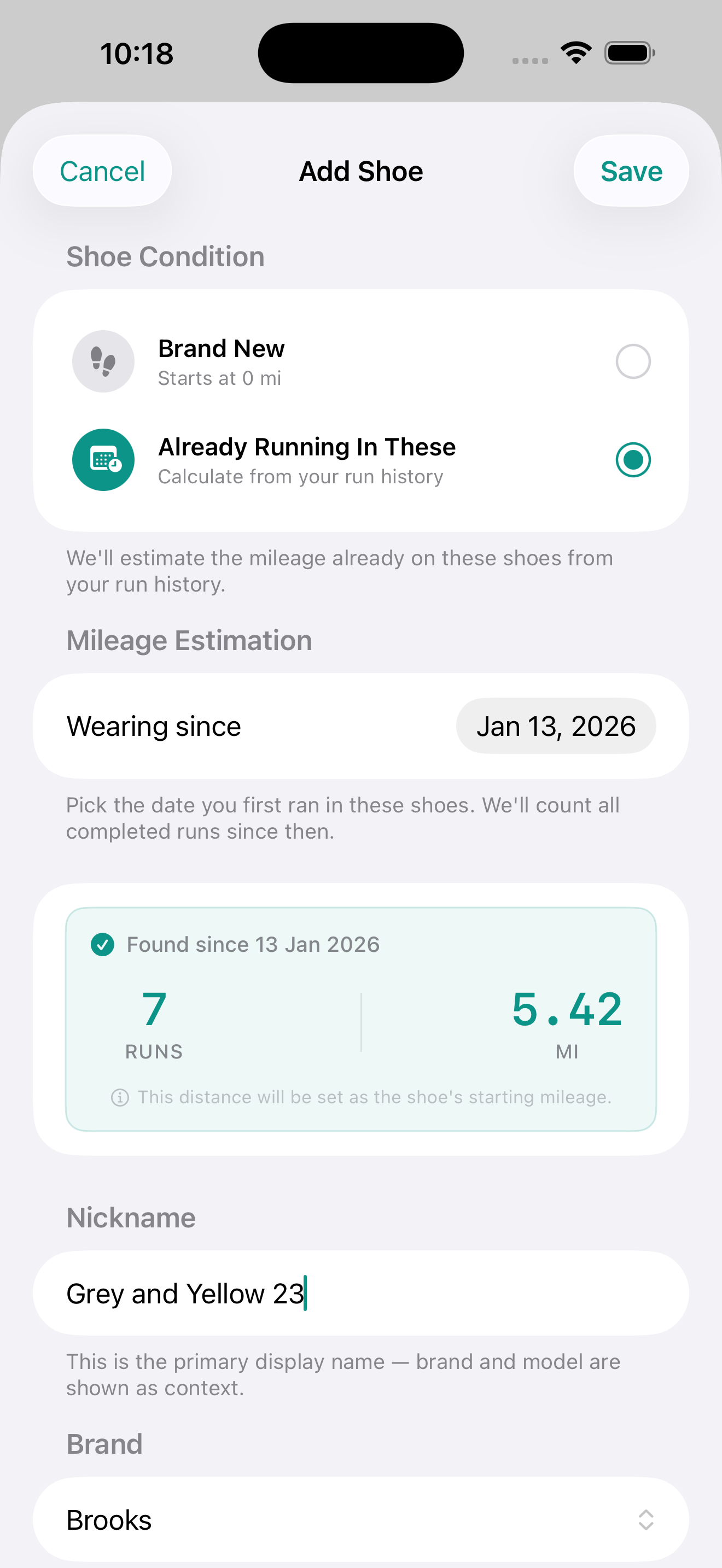 Add Shoe screen showing the condition picker set to 'Already Running In These', a 'Wearing since' date field set to January 2026, and a summary card reading '7 RUNS · 5.42 MI — Found since 13 Jan 2026. This distance will be set as the shoe's starting mileage.' Below that: a Nickname field with 'Grey and Yellow 23', and a Brand dropdown set to Brooks.